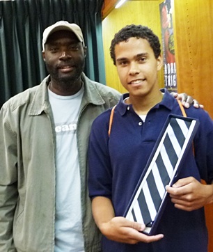 Antwone Fisher with the young man, Marcus, who won a TIE at Vroman's